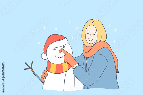Enjoying winter and activities outdoors concept. Young smiling woman cartoon character making snowman and enjoying wintertime with snow outdoors vector illustration 