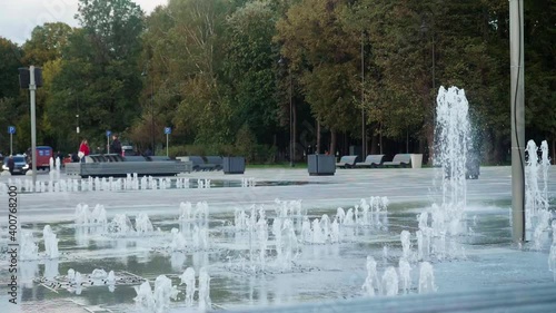 Slow motion of fountain streams in a park near Rechnoy station in Moscow. Beautiful city views. photo