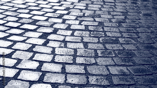 Shiny, wet pavement on the street.