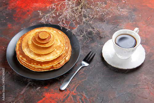 Close up view of homemade pancakes with acup of tea photo