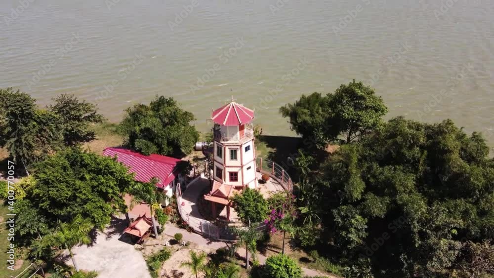 Drone footage over an old lighthouse in Koh Dach (Silk Island) along