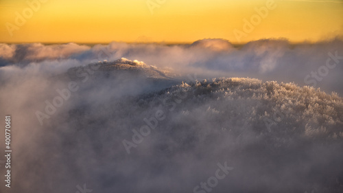 Fototapeta Naklejka Na Ścianę i Meble -  Mountain peaks over the clouds. An unigue vista. Bieszczady National Park. Carpathians. Poland.
