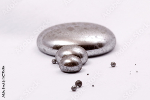 mercury mineral with white background. liquid grey mineral of mercury