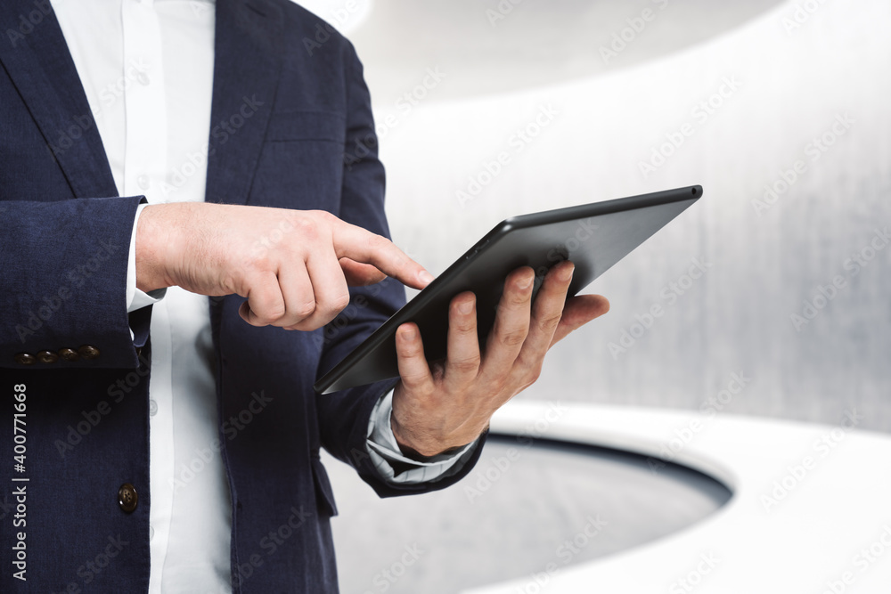 Businessman hand clicks on the screen of a digital tablet in conference room, close up. Internet Work Concept Businessman hand clicks on the screen of a digital tablet in conference room, close up. Internet Work Concept