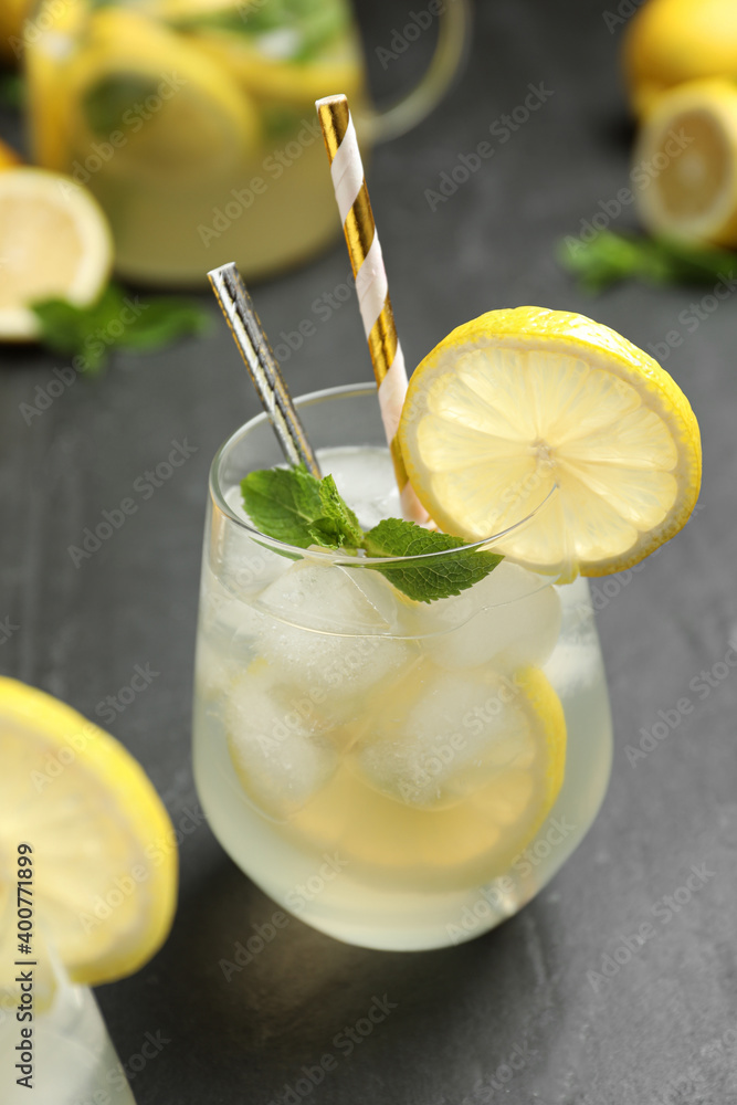 Natural lemonade with mint on grey table, closeup. Summer refreshing drink Natural lemonade with mint on grey table, closeup. Summer refreshing drink