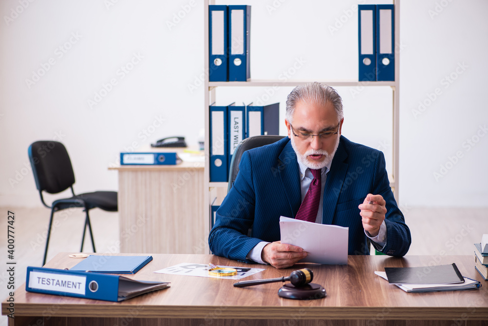 Experienced male judge sitting in the office Experienced male judge sitting in the office
