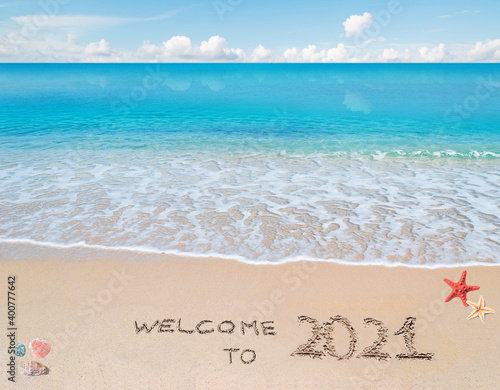 welcome to 2021 written on the beach