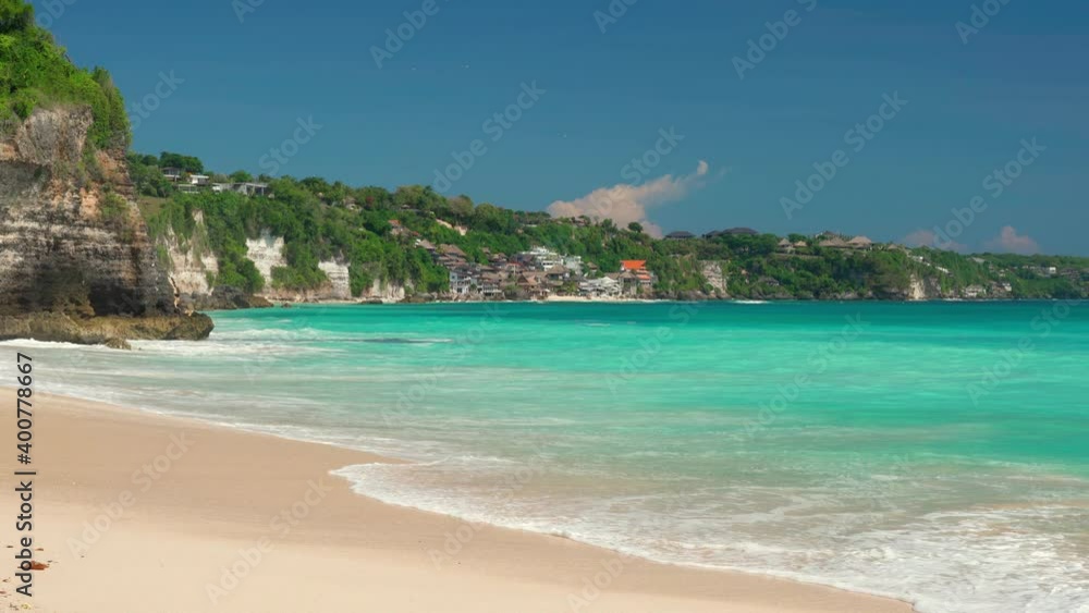 Beautiful sand beach with crystal clear ocean on background blue sky. 4K Beautiful sand beach with crystal clear ocean on background blue sky. 4K