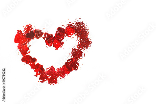 Red heart under glass surface with water drops close. Valentines background  love  date concept