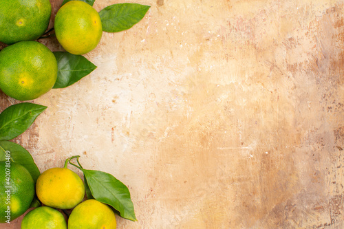 top view sour green tangerines on light background citrus tree photo exotic fruit free place