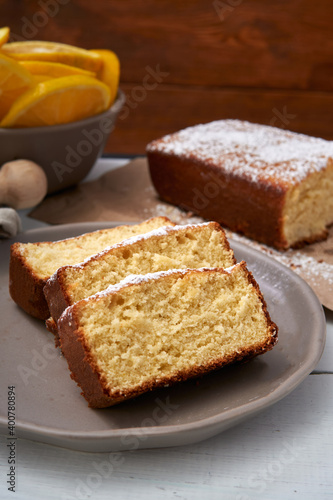 Orange spongecake made with butter and powdered sugar in the top