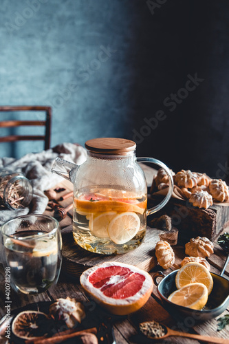 Hot tea with slices of fresh grapefruit on wooden tablet. Healthy drink  Eco  vegan