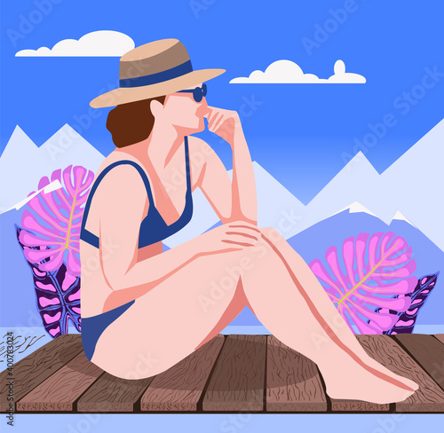 Portrait of Beautiful woman in a swimsuit on wood floor. Nature seascape and a young woman relaxing and looking forward to the mountains.