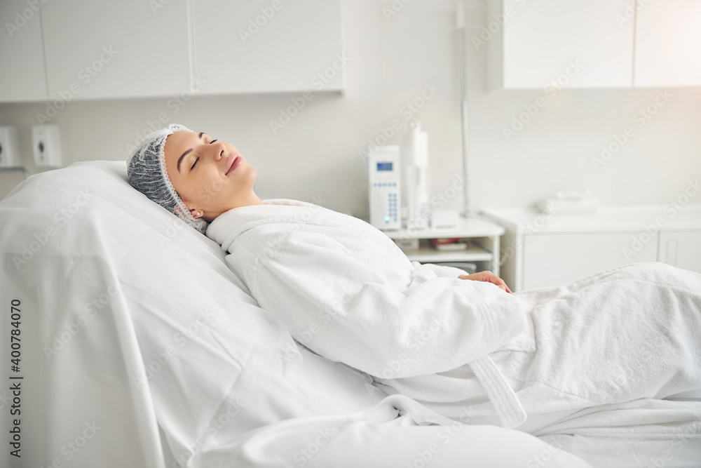 Calm spa client relaxing before a cosmetic procedure Calm spa client relaxing before a cosmetic procedure
