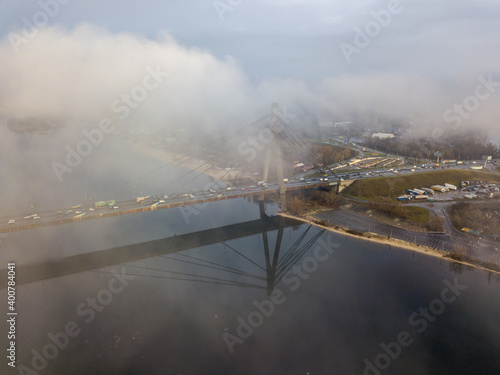 Aerial drone view. North bridge in Kiev, shrouded in morning fog.