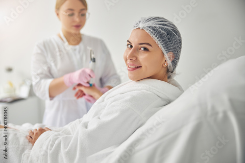 Dermatologist treating the skin on a female hand