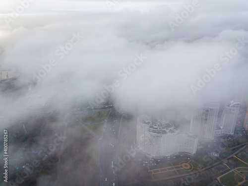 Aerial drone view. Low clouds over the Dnieper river in Kiev. Foggy autumn morning. © Sergey