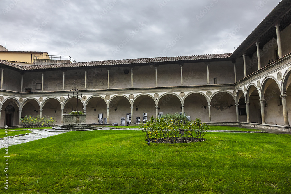 Cloister in Holy Cross Basilica (Basilica di Santa Croce, 1385) - Franciscan church on Piazza di Santa Croce. Basilica is largest Franciscan church in world. Florence, Italy.