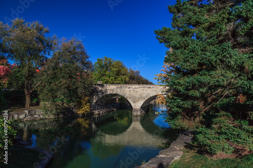 Huron Street Bridge, Shakespeare theme garden, Stratford, On, Canada. This stone bridge was built in 1885, is the only double-arched bridge in North America still in use for automotive traffic.