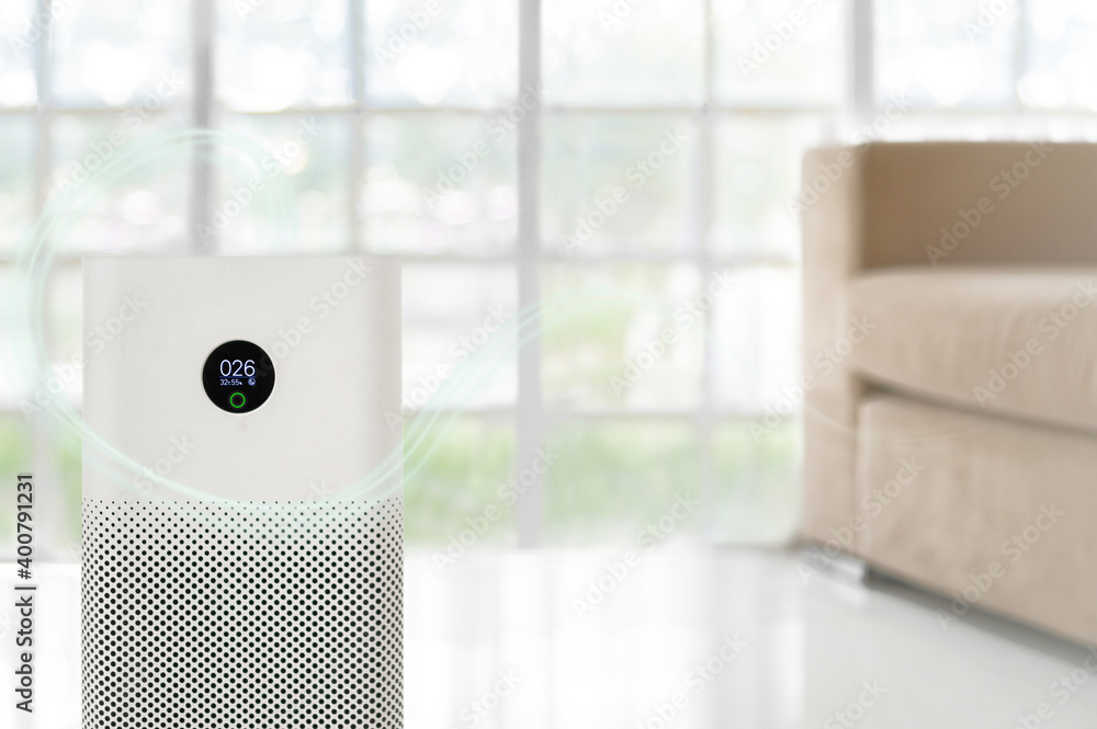 air purifier a living room, air cleaner removing fine dust in house. protect PM 2.5 dust and air pollution concept air purifier a living room, air cleaner removing fine dust in house. protect PM 2.5 dust and air pollution concept