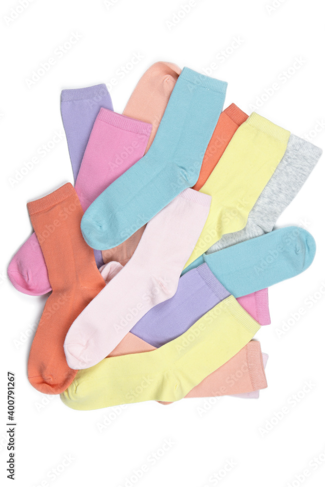 Lot of multicolored children's socks without pattern, isolated on white background, flatly, minimal style. Concept children's clothing, housekeeping, washing, sorting, decluttering, organizing space Lot of multicolored children's socks without pattern, isolated on white background, flatly, minimal style. Concept children's clothing, housekeeping, washing, sorting, decluttering, organizing space
