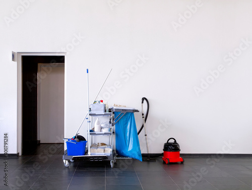 Cleaning equipment near a restroom in a clean office environment