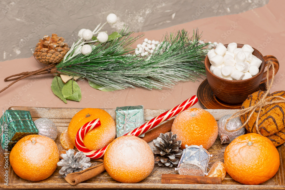 Tangerines and coffee with marshmallows in New Year's composition. Christmas table, close-up, selective focus Tangerines and coffee with marshmallows in New Year's composition. Christmas table, close-up, selective focus