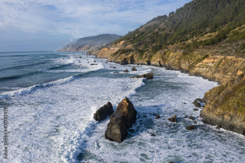 The cold waters of the Pacific Ocean wash against the rocky Northern California coastline in Mendocino. The scenic Pacific Coast Highway runs along this amazing part of the west coast.