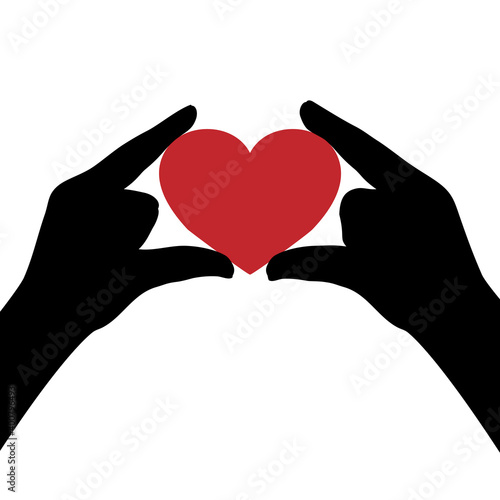 Silhouettes of hands holding heart. Heart symbol of love