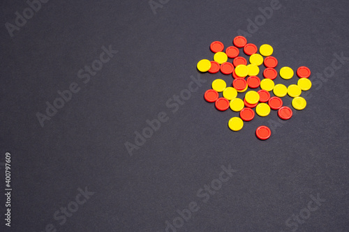 Colored chips on a black background