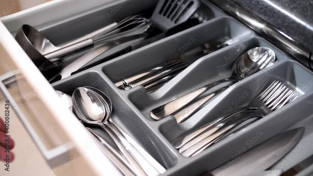 Clean and tidy kitchenware in a drawer in the kitchen Clean and tidy kitchenware in a drawer in the kitchen