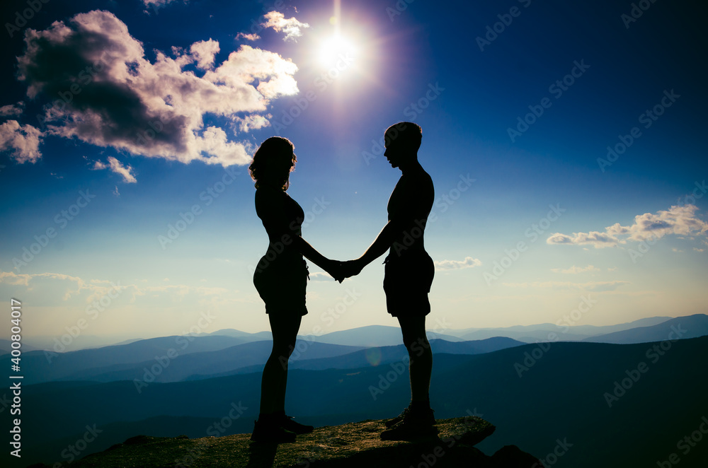 A guy and a girl look at each other at a height