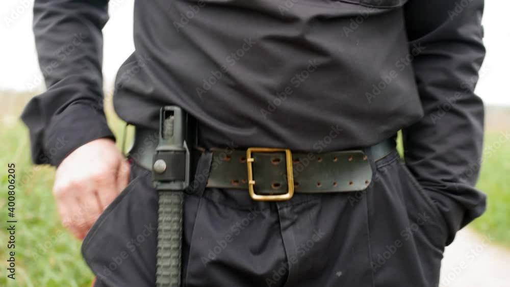 Policeman are investigating in military uniform in the countryside. Policeman are investigating in military uniform in the countryside.