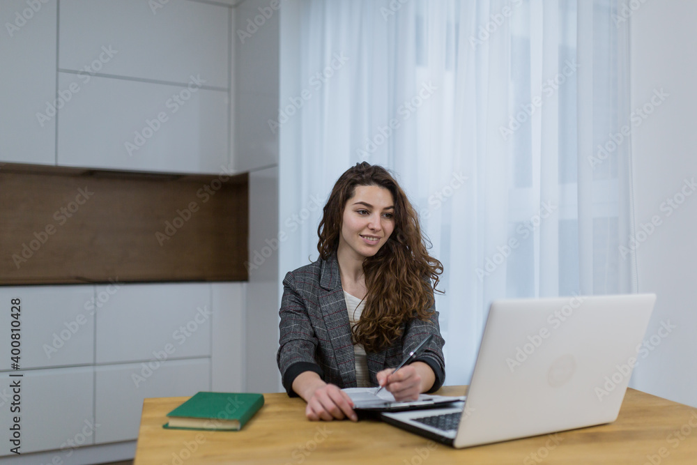 Beautiful woman teaching, teaching online sitting at home Beautiful woman teaching, teaching online sitting at home