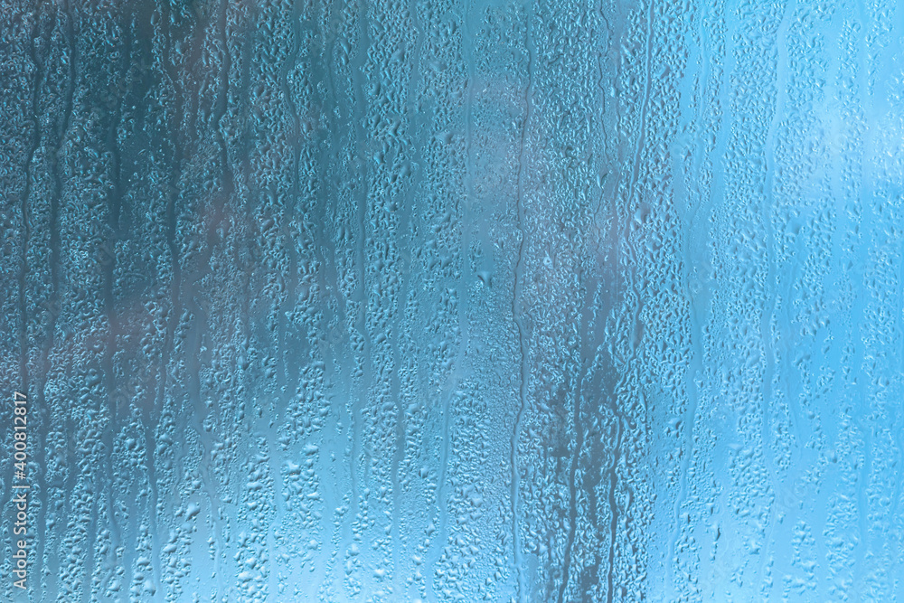 Condensation on the clear glass window. Water drops. Rain. Abstract background texture Condensation on the clear glass window. Water drops. Rain. Abstract background texture