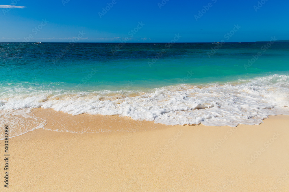 Tropical sandy seashore with blue wave on the Boracay island Philippines. Beach top view overhead seaside.
