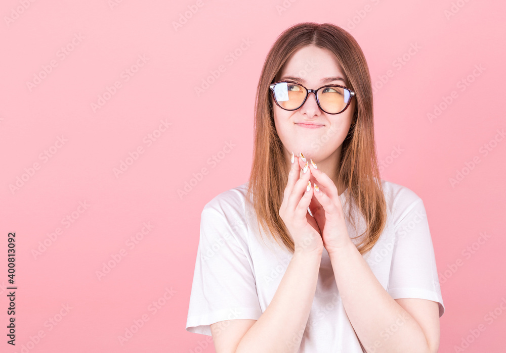 Portrait of young woman thinking and looks to copyspace Portrait of young woman thinking and looks to copyspace