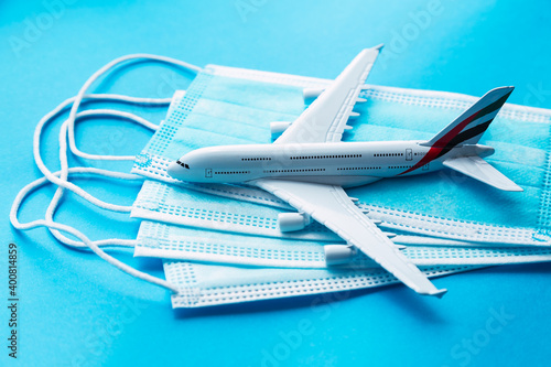 a top view of a white airline comercial airplane some blue masks