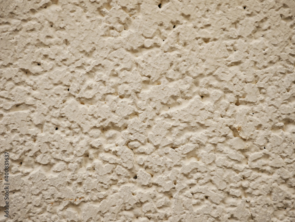 Close-up of the surface of an old white painted plaster wall Close-up of the surface of an old white painted plaster wall