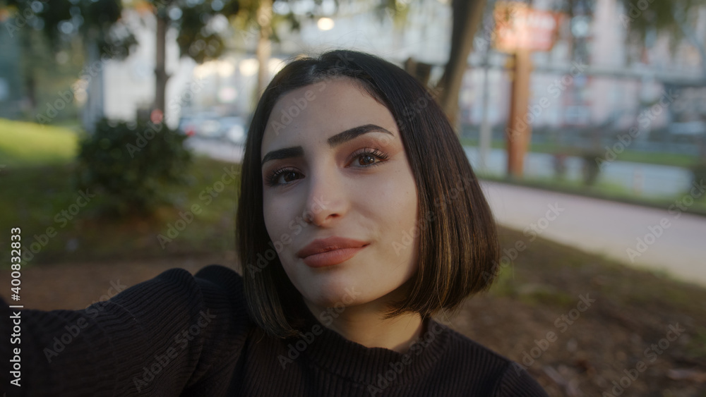 Lifestyle selfie portrait of young positive woman with having fun selfie in park smile girl feel happy street smartphone vacation positive close up Lifestyle selfie portrait of young positive woman with having fun selfie in park smile girl feel happy street smartphone vacation positive close up
