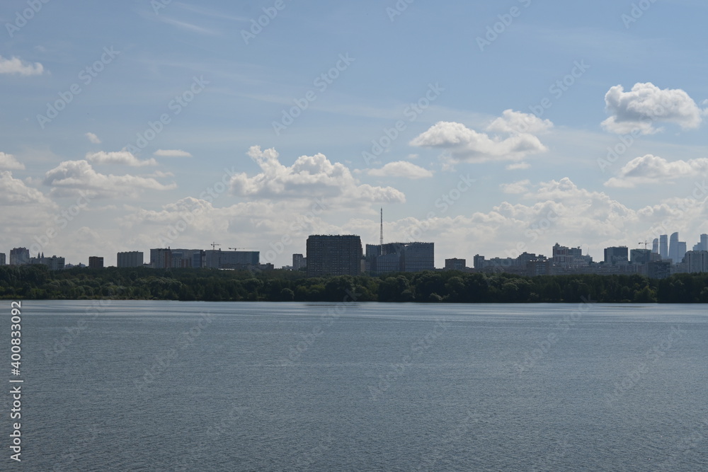 Sunny sky with clouds on the Bay with seagulls and sailboat