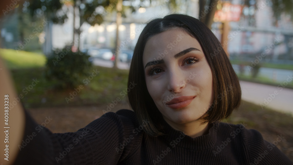 Lifestyle selfie portrait of young positive woman with having fun selfie in park smile girl feel happy street smartphone vacation positive close up Lifestyle selfie portrait of young positive woman with having fun selfie in park smile girl feel happy street smartphone vacation positive close up