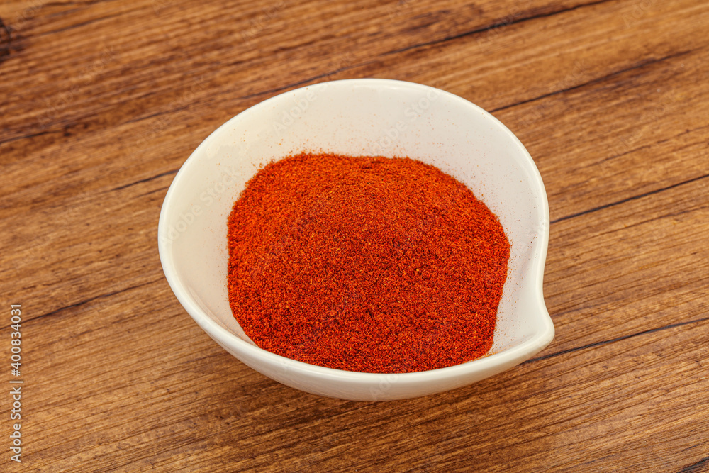 Dry paprika powder in the bowl Dry paprika powder in the bowl