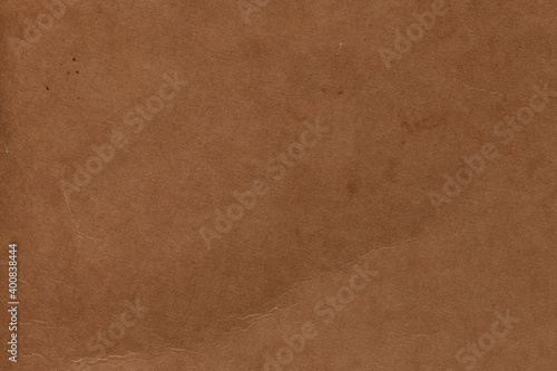 Vintage and old looking paper background. Retro cardboard texture. Grunge paper for drawing. Ancient book page.