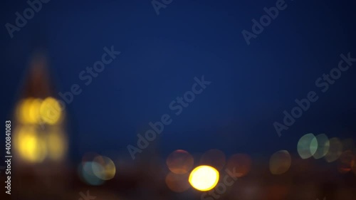 Defocused blurry focus rack of Historic Italian town of San Lorenzo in Rome, Italy with cityscape skyline with high angle aerial view of old buildings church tower at dark sunset twilight night photo
