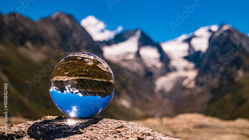 Crystal ball alpine landscape shot at the famous Hohe Mut summit, Obergurgl, Oetztal, Tyrol, Austria photo