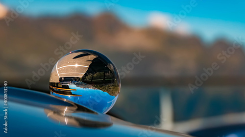 Crystal ball alpine landscape shot at the famous Timmelsjoch high alpine road, Dolomites, South Tyrol, Italy