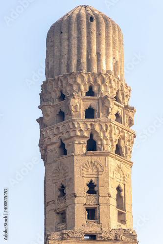 minaret of public historic Al Hakim Mosque known as the enlightened mosque located in Moez street, old Cairo, Egypt photo