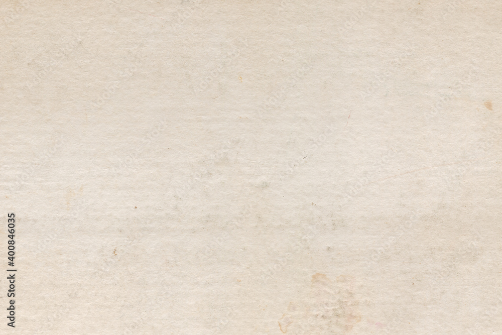Fototapeta premium Vintage and old looking paper background. Retro cardboard texture. Grunge paper for drawing. Ancient book page.