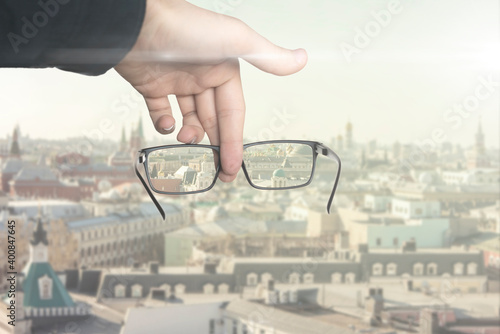 optical eyevision concept, frame of eyeglasses show focused image on the blurred background photo